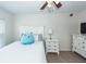 This bedroom features a ceiling fan, neutral decor, and a bed with white furniture at 2052 Bancroft Ln, Mount Pleasant, SC 29466