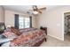 This bedroom features a ceiling fan, neutral decor, and a bed with brown bedding at 2052 Bancroft Ln, Mount Pleasant, SC 29466