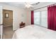 Inviting bedroom with natural light from the window and burgundy curtains at 2052 Bancroft Ln, Mount Pleasant, SC 29466