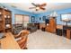 Bonus room with built in bookcase and dark leather chairs and a ceiling fan at 2052 Bancroft Ln, Mount Pleasant, SC 29466