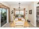 Cozy dining room with a table set for four, bathed in natural light from the sliding glass door at 2052 Bancroft Ln, Mount Pleasant, SC 29466