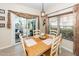Bright dining area offering a wooden table, comfortable seating, and access to a patio at 2052 Bancroft Ln, Mount Pleasant, SC 29466