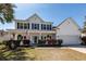 Charming two-story home with a covered front porch and manicured landscaping at 2052 Bancroft Ln, Mount Pleasant, SC 29466