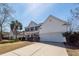 Charming two-story home with a well-manicured lawn and inviting front porch at 2052 Bancroft Ln, Mount Pleasant, SC 29466