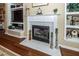 Close-up of the fireplace with hardwood floors, shelving and mantle at 2052 Bancroft Ln, Mount Pleasant, SC 29466