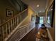 Entryway with wood floors, wall decor, table and staircase on left at 2052 Bancroft Ln, Mount Pleasant, SC 29466