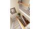 Foyer with stairs leading down with light railing and neutral carpet at 2052 Bancroft Ln, Mount Pleasant, SC 29466