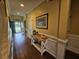 Inviting foyer with wood floors and decor on side table at 2052 Bancroft Ln, Mount Pleasant, SC 29466