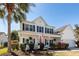 Charming two-story home featuring a front porch, American flag, and meticulous landscaping in a desirable location at 2052 Bancroft Ln, Mount Pleasant, SC 29466