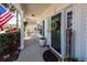 Inviting front porch with rocking chairs and decorative potted plants at 2052 Bancroft Ln, Mount Pleasant, SC 29466