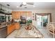 Spacious kitchen boasts granite countertops, wood cabinets, and an island, leading to an outdoor patio at 2052 Bancroft Ln, Mount Pleasant, SC 29466