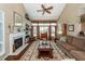 Cozy living room features a fireplace, built-in shelving, and plenty of natural light at 2052 Bancroft Ln, Mount Pleasant, SC 29466