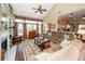 Bright living room with vaulted ceiling, fireplace, large windows, and hardwood floors at 2052 Bancroft Ln, Mount Pleasant, SC 29466