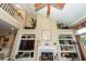 Spacious living room with a fireplace, built-in shelving, hardwood floors, and vaulted ceilings at 2052 Bancroft Ln, Mount Pleasant, SC 29466