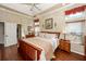 This bedroom boasts hardwood floors, lots of natural light, and access to the ensuite bathroom at 2052 Bancroft Ln, Mount Pleasant, SC 29466