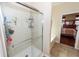 Shower with glass door is adjacent to a bath tub and provides access to the Primary bedroom at 2052 Bancroft Ln, Mount Pleasant, SC 29466