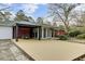 The backyard features a deck with dining, exterior access to the home, and landscaped backyard at 211 Logan Dr, Summerville, SC 29483