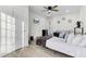 Bright bedroom featuring twin beds, a TV, mini fridge, and convenient access to the bathroom at 211 Logan Dr, Summerville, SC 29483