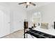 Cozy bedroom with wood-look floors, ceiling fan, and a comfortable bed perfect for relaxation at 211 Logan Dr, Summerville, SC 29483