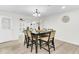 Bright dining room with seating for six and stylish chandelier at 211 Logan Dr, Summerville, SC 29483