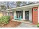 Cozy front porch featuring seating, a welcome mat, and charming architectural details, perfect for relaxing outdoors at 211 Logan Dr, Summerville, SC 29483