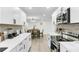 Charming kitchen with stainless steel appliances, white cabinets, and adjacent dining area at 211 Logan Dr, Summerville, SC 29483