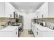 Modern kitchen with white cabinets, stainless steel appliances, and sleek countertops, designed for both cooking and gathering at 211 Logan Dr, Summerville, SC 29483