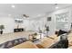 Bright and airy living room with sleek flooring, and a cozy sofa, ideal for relaxing and enjoying entertainment at 211 Logan Dr, Summerville, SC 29483