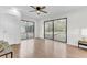Spacious living room with wood-look floors, lots of natural light, and sliding glass doors at 211 Logan Dr, Summerville, SC 29483