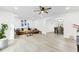 Open-concept living room with modern flooring, neutral decor, and seamless flow to dining, perfect for entertaining at 211 Logan Dr, Summerville, SC 29483