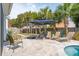 Spacious travertine backyard area provides plenty of room to lounge around the refreshing pool at 2165 Annie Laura Ln, Mount Pleasant, SC 29466