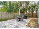 Outdoor patio area with mature landscaping, barbecue grill, and wrought iron table setting at 2165 Annie Laura Ln, Mount Pleasant, SC 29466