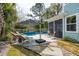 Relaxing backyard featuring a pool, spa, lounge seating, and manicured landscaping at 2165 Annie Laura Ln, Mount Pleasant, SC 29466