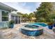Beautiful backyard with inviting pool, hot tub, mature landscaping, and plenty of lounge seating at 2165 Annie Laura Ln, Mount Pleasant, SC 29466