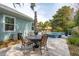 Landscaped backyard featuring an outdoor dining area, in-ground pool, and privacy fencing at 2165 Annie Laura Ln, Mount Pleasant, SC 29466