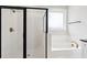 Modern bathroom featuring a glass shower with black trim and gold fixtures, plus a luxurious soaking tub at 2165 Annie Laura Ln, Mount Pleasant, SC 29466