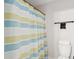 Practical bathroom features a striped shower curtain, toilet, and towel rack for functionality at 2165 Annie Laura Ln, Mount Pleasant, SC 29466