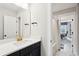Well-lit bathroom boasts a single sink vanity with gold fixtures, and a view into the adjacent room with shower at 2165 Annie Laura Ln, Mount Pleasant, SC 29466