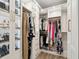Custom closet with built in shelves, drawers, glass front cabinets, and hanging rods at 2165 Annie Laura Ln, Mount Pleasant, SC 29466