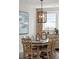 Well-lit dining room with an elegant chandelier, large windows, and refined decor at 2165 Annie Laura Ln, Mount Pleasant, SC 29466