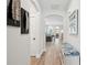 Inviting hallway features beautiful wood floors, stylish decor, and archways leading to living spaces at 2165 Annie Laura Ln, Mount Pleasant, SC 29466