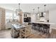 Open concept kitchen featuring stainless steel appliances, a large island, and adjacent dining area at 2165 Annie Laura Ln, Mount Pleasant, SC 29466