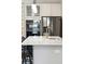 Close up on a kitchen island with a quartz countertop, stainless steel appliances, and gold hardware at 2165 Annie Laura Ln, Mount Pleasant, SC 29466