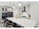 Contemporary kitchen with quartz countertops, island seating, pendant lighting and stainless steel appliances at 2165 Annie Laura Ln, Mount Pleasant, SC 29466