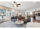 A comfortable open-concept living room featuring a ceiling fan and view of kitchen and dining area at 2165 Annie Laura Ln, Mount Pleasant, SC 29466