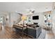 Spacious living room showcases modern furniture, a fireplace, staircase and lots of natural light at 2165 Annie Laura Ln, Mount Pleasant, SC 29466