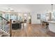 Open-concept living room featuring wood floors, lots of natural light and a cozy dining area at 2165 Annie Laura Ln, Mount Pleasant, SC 29466