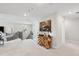Spacious loft area with a comfortable seating area, decorative table, and staircase at 2165 Annie Laura Ln, Mount Pleasant, SC 29466