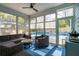 Enclosed patio featuring wicker furniture, ceiling fan, and views of the backyard pool at 2165 Annie Laura Ln, Mount Pleasant, SC 29466