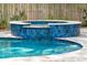 Inviting pool with connected hot tub accented with blue tile and decorative stone at 2165 Annie Laura Ln, Mount Pleasant, SC 29466